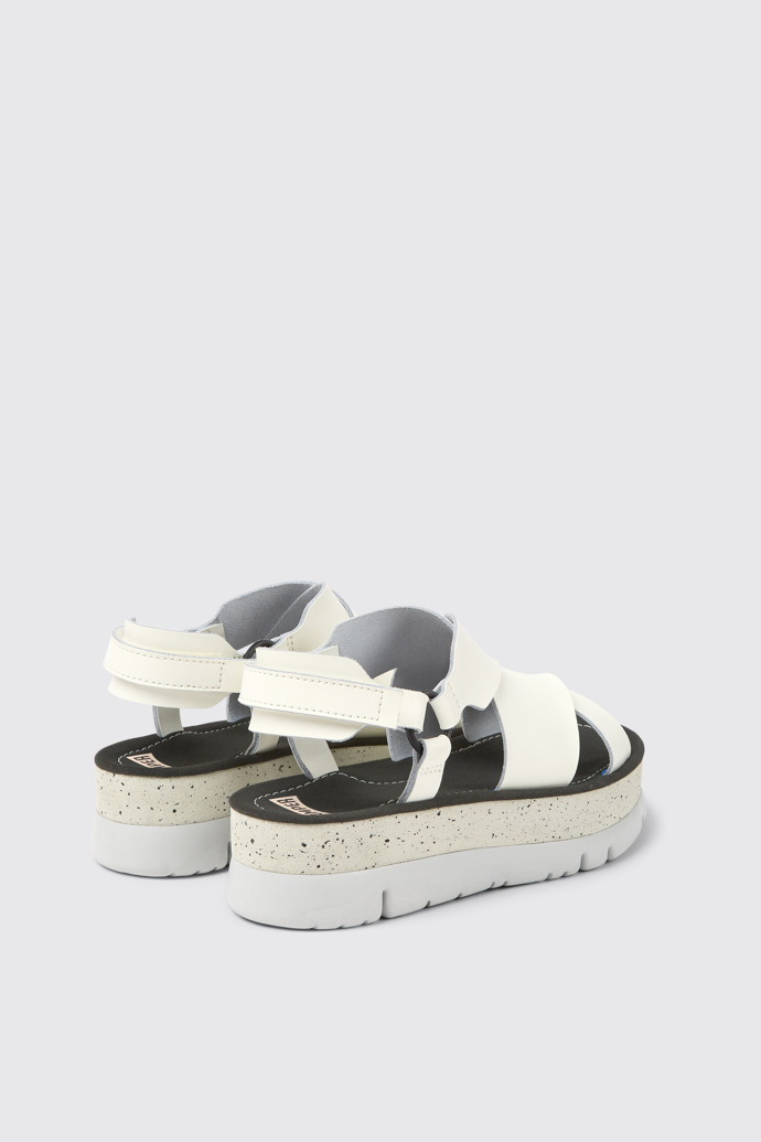 Back view of Oruga Up White leather sandals for women