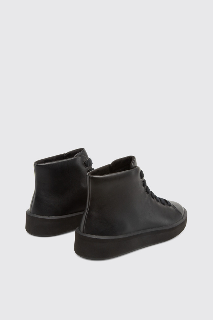 Back view of Courb Women's black ankle boot