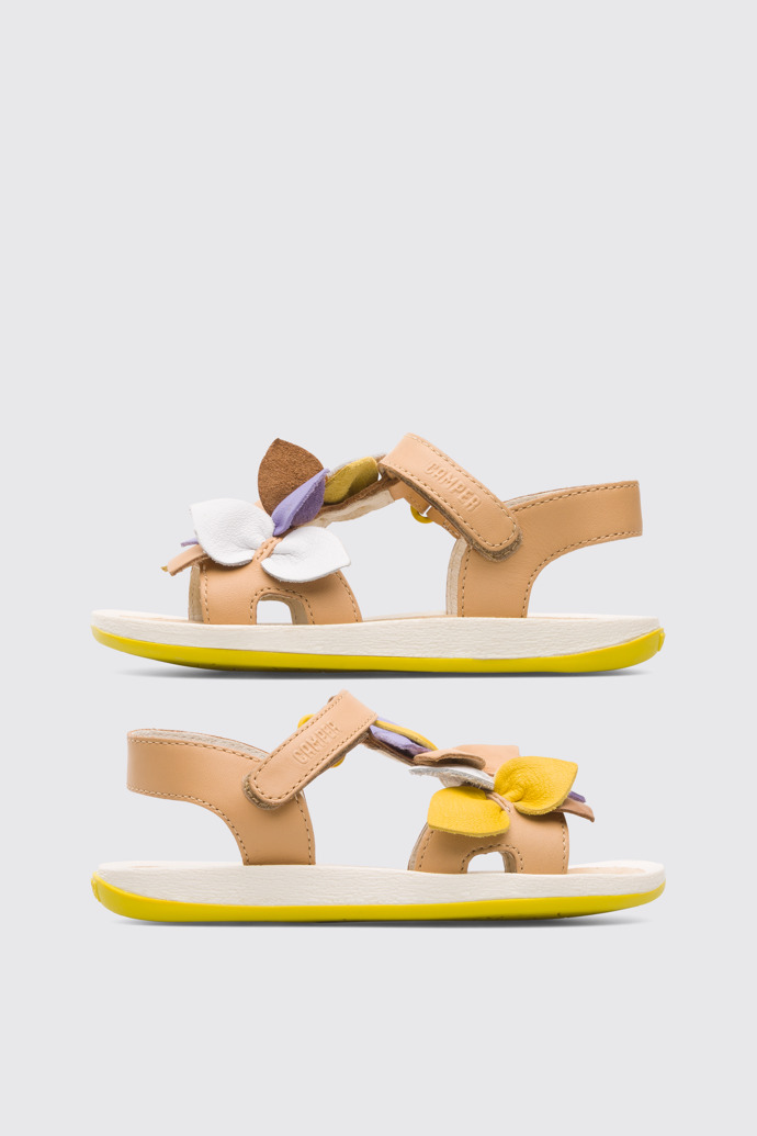Side view of Twins Nude and multi-colored girl’s strappy sandal
