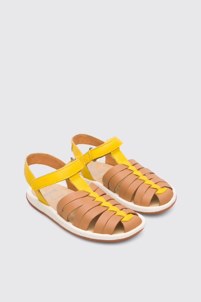 Front view of Bicho Closed yellow and tan nude T-strap sandal for kids