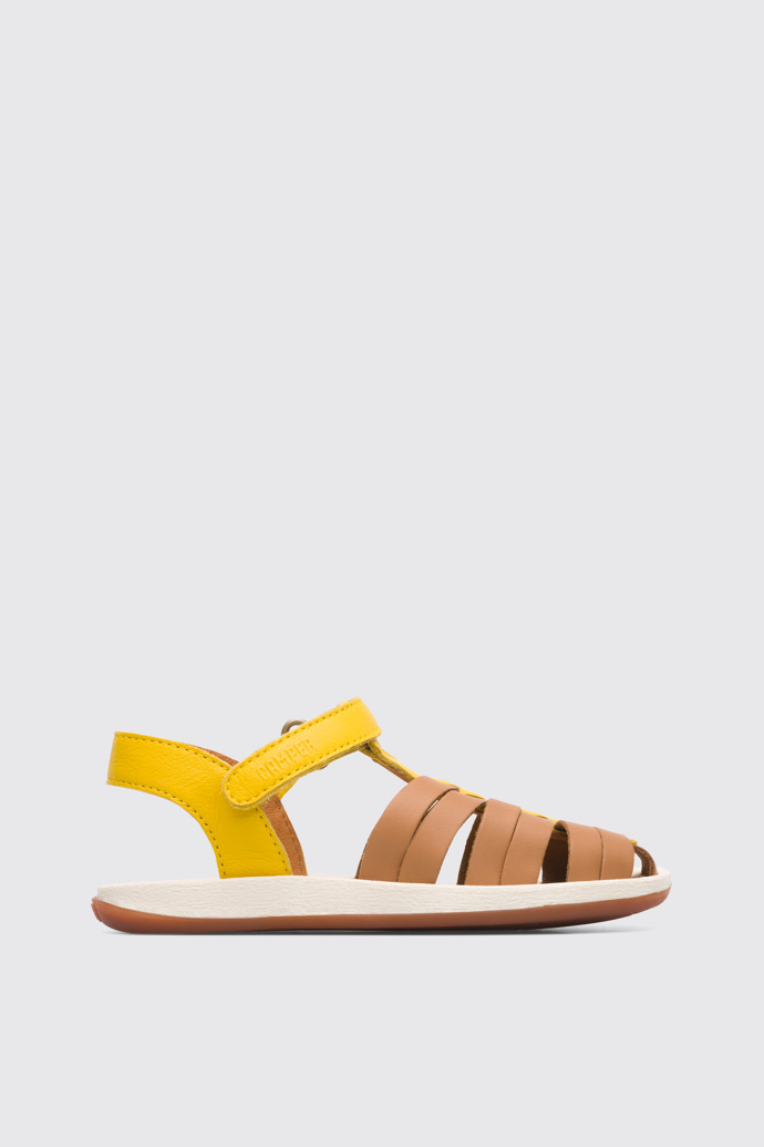 Side view of Bicho Closed yellow and tan nude T-strap sandal for kids