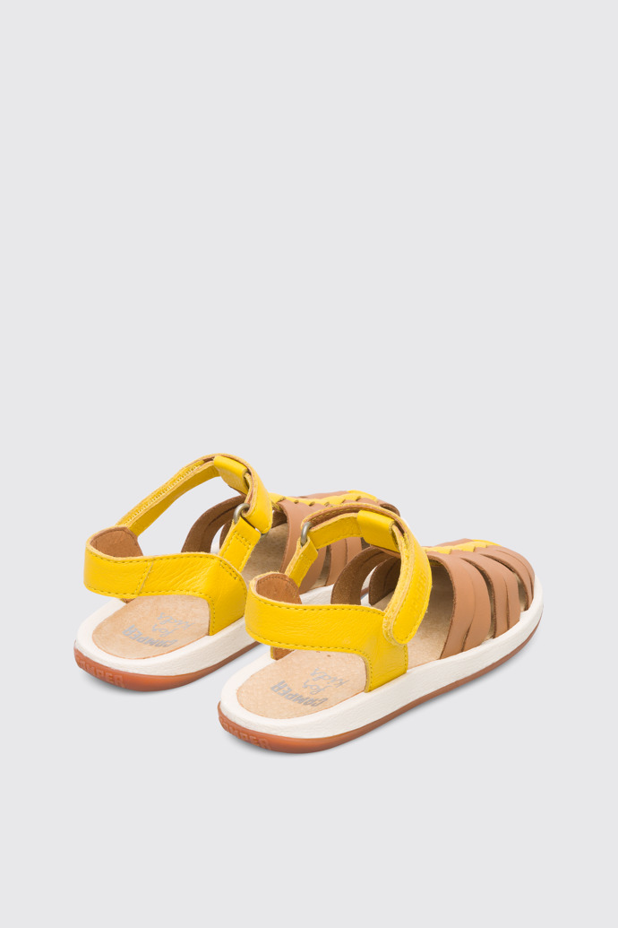 Back view of Bicho Closed yellow and tan nude T-strap sandal for kids