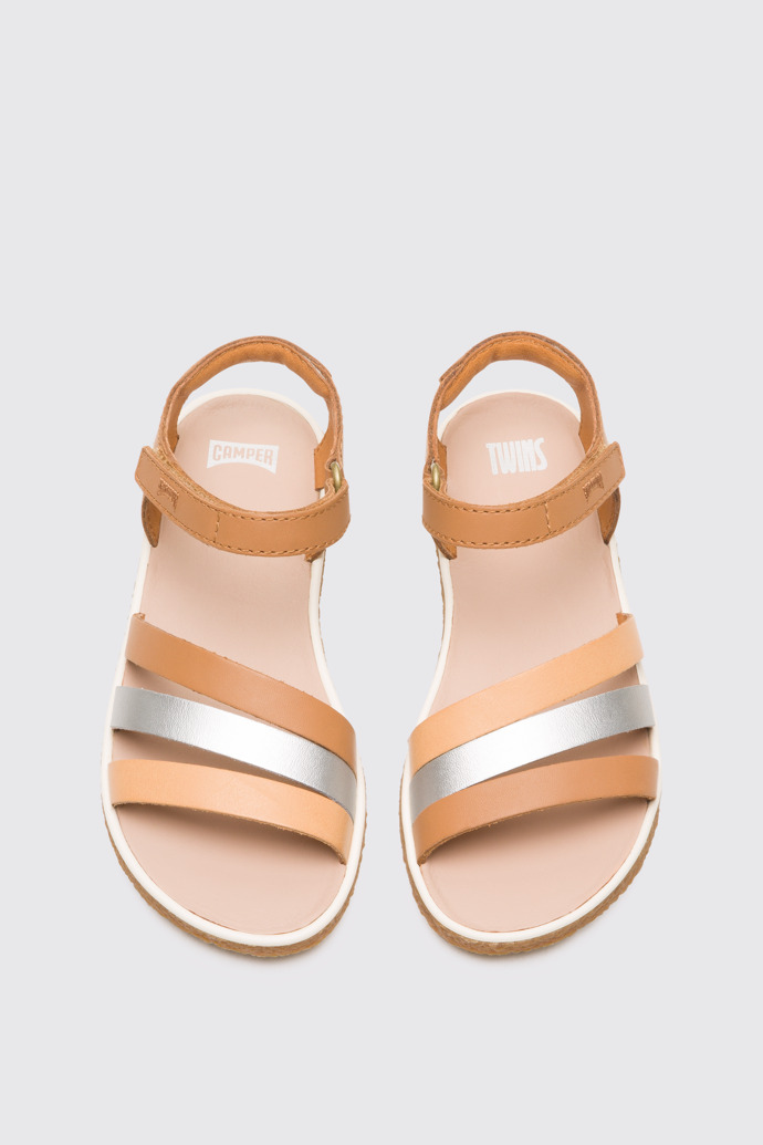 Overhead view of Twins Silver and nude girl’s sandal