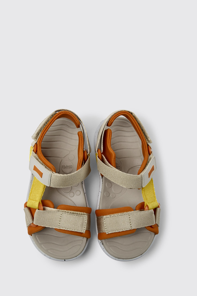 Overhead view of Wous Yellow, orange, and beige sandals for kids