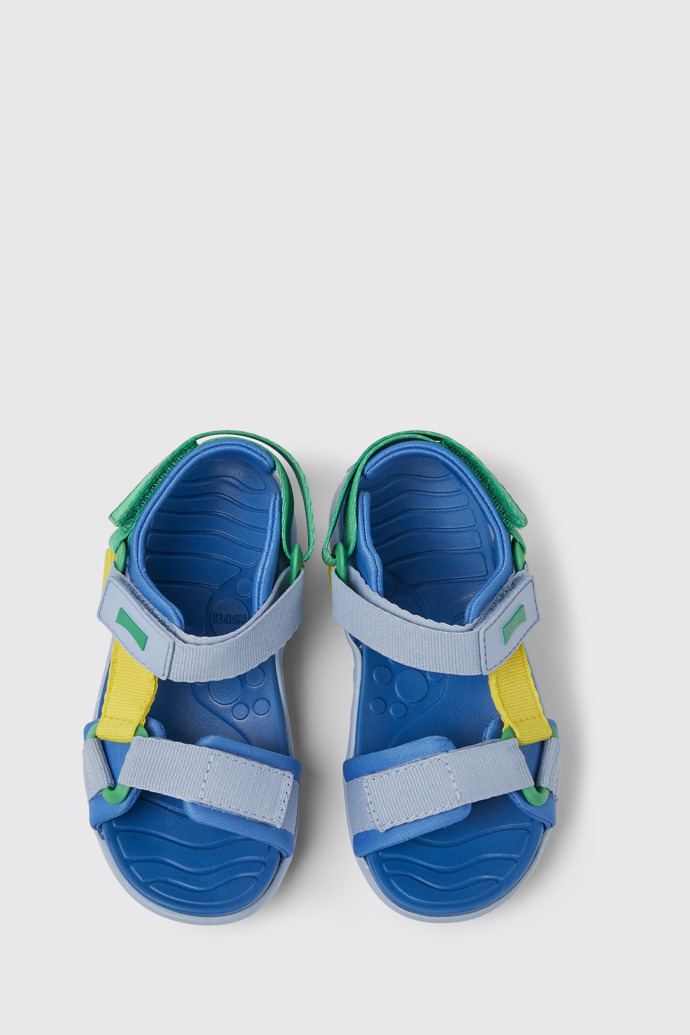 Overhead view of Wous Blue, yellow, and green sandals for kids