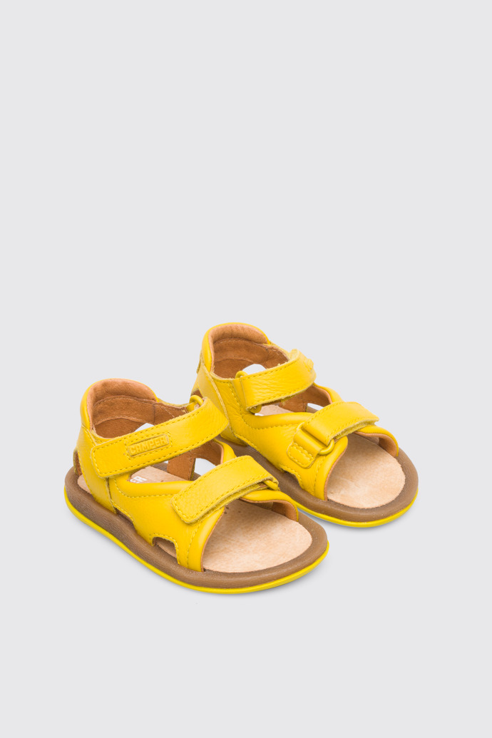 Front view of Bicho Yellow strappy kids’ sandal