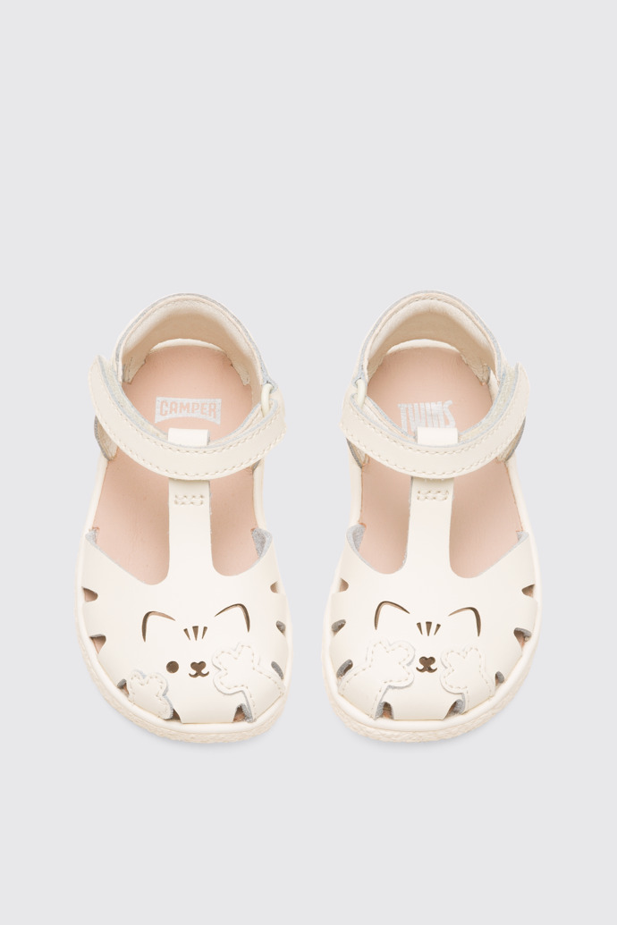 Overhead view of Twins Girl’s cream T-strap sandal