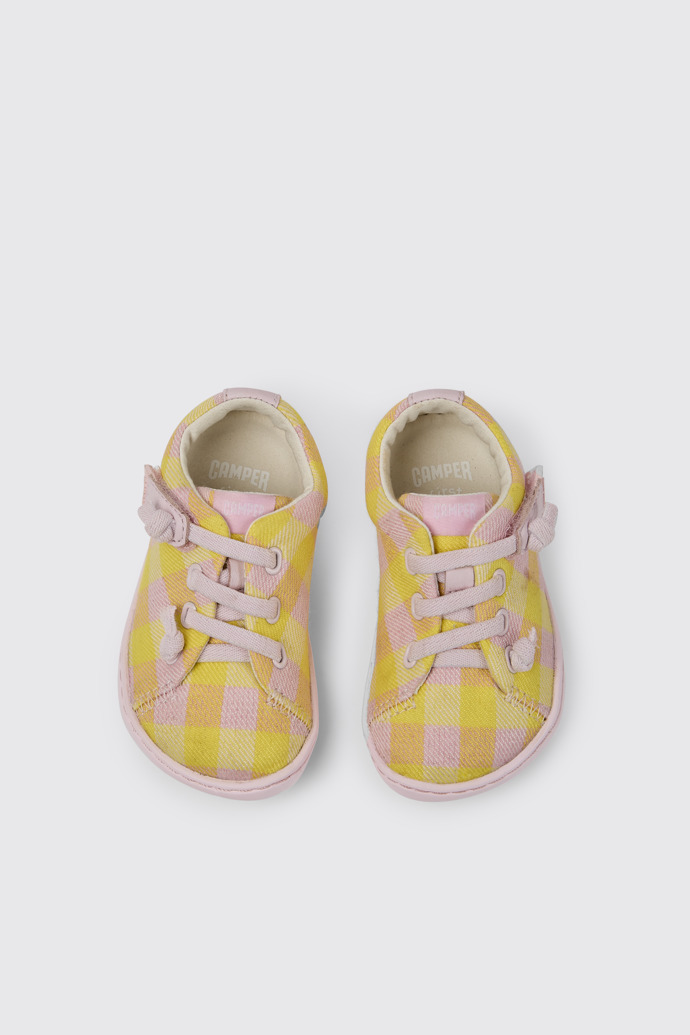 Overhead view of Peu Pink and yellow shoes for kids