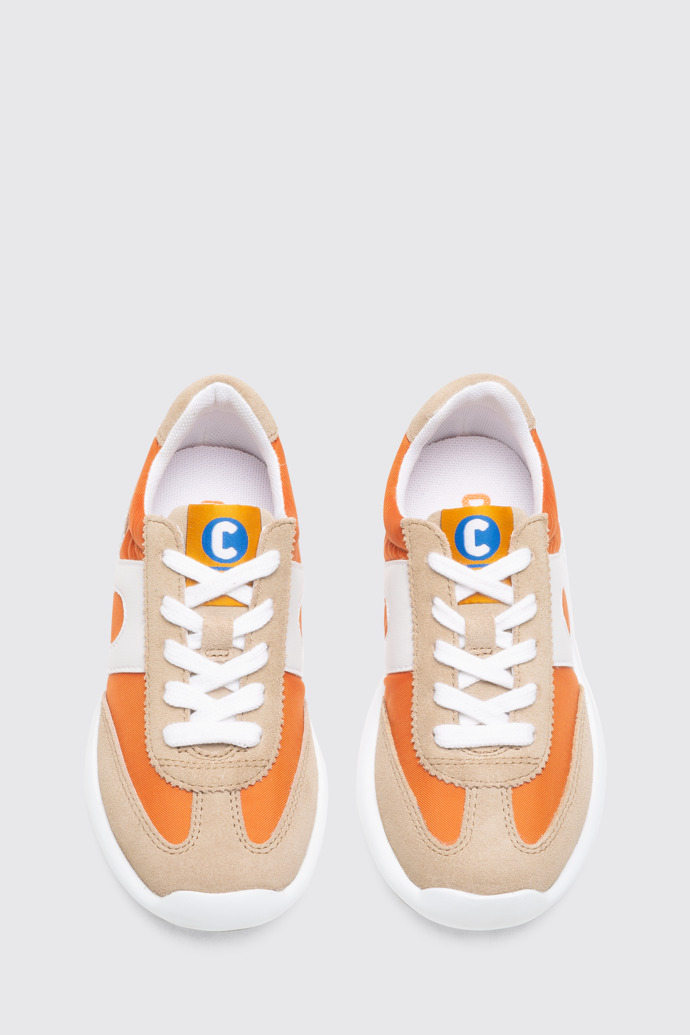 Overhead view of Driftie Orange and beige kids’ sneaker