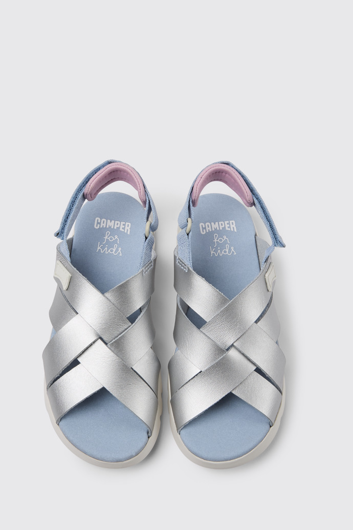 Overhead view of Oruga Silver leather sandals for kids