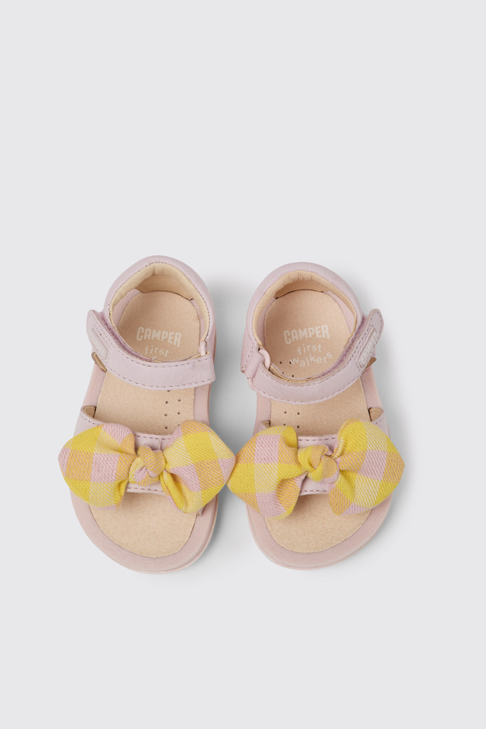 Overhead view of Bicho Pink and yellow sandals for kids