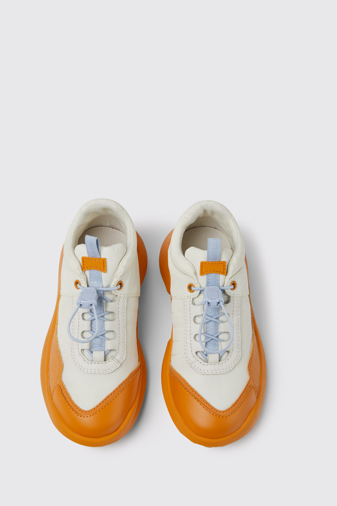 Overhead view of CRCLR White and orange sneakers for kids