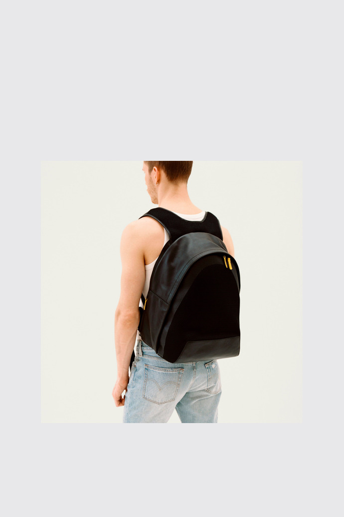 A model wearing Naveen Black Backpacks for Unisex