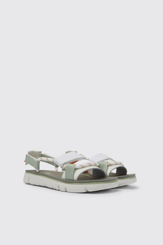 Front view of Oruga White, green, and orange sandals for women
