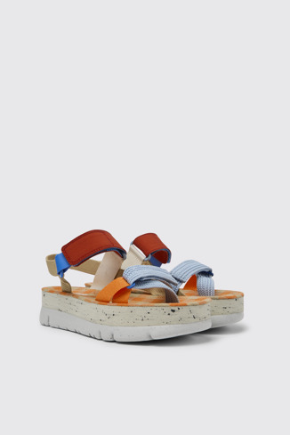 Front view of Oruga Up Beige, blue, and red sandals for women