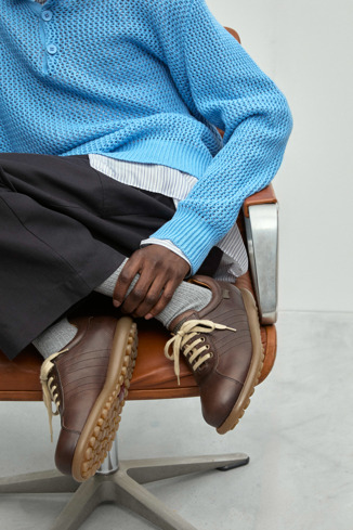 A model wearing Pelotas Brown vegetable tanned leather shoes for men