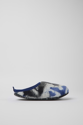 Side view of Wabi Blue, black, and white recycled wool slippers for women