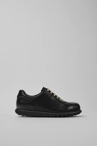 Side view of Pelotas Iconic black shoe for women