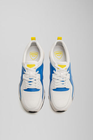 Overhead view of Caddie White and blue golf sneakers