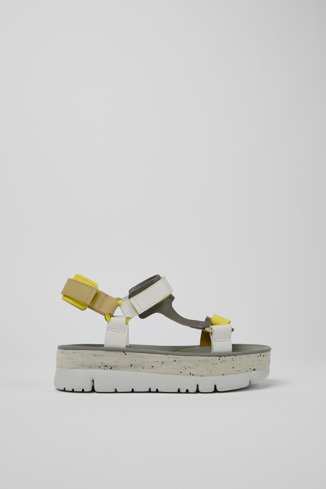 Side view of Oruga Up White, grey, and yellow leather sandals for women