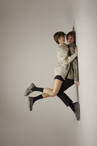 A model wearing Twins Gray leather loafers for women