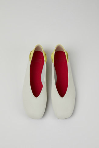 Overhead view of Casi Myra White and yellow leather ballerina flats for women