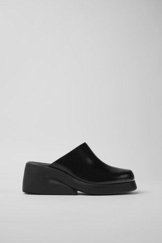 Side view of Kaah Black leather clogs