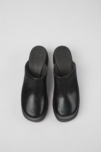 Overhead view of Kaah Black leather mules for women