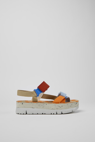 Side view of Oruga Up Beige, blue, and red sandals for women