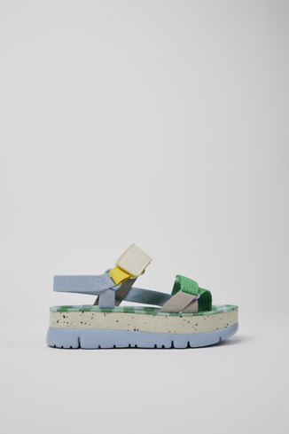 Side view of Oruga Up Blue, green, and grey sandals for women