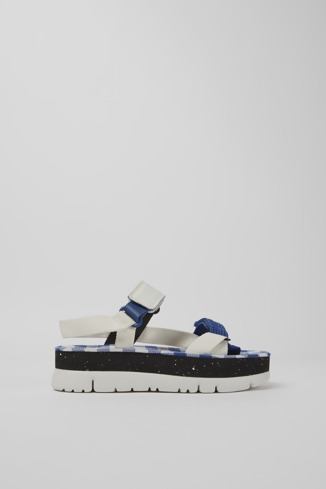 Side view of Oruga Up White, blue, and black sandals for women