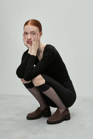 A model wearing Milah Brown nubuck loafers for women