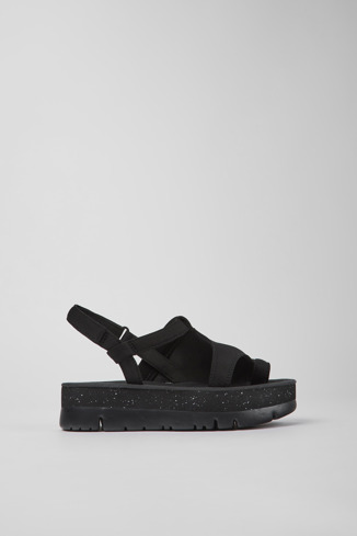 Side view of Oruga Up Black textile sandals for women