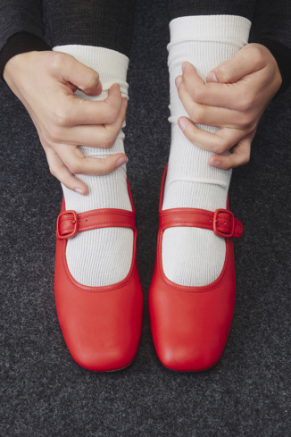 A model wearing Casi Myra Red Leather Shoes for Women.