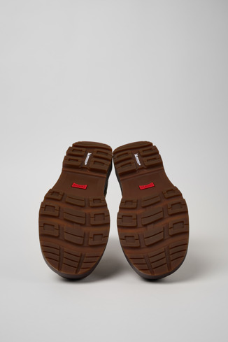 The soles of Brutus Trek Brown nubuck ankle boots for men