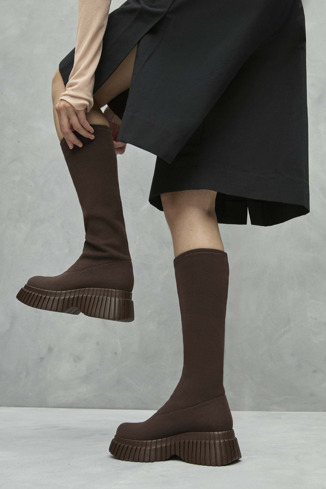 A model wearing BCN TENCEL® Brown textile boots for women