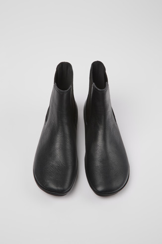 Overhead view of Right Black leather ankle boots