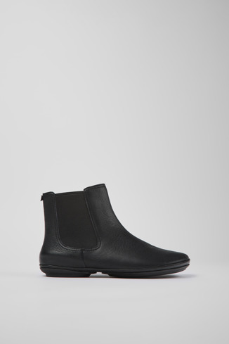 Side view of Right Black leather ankle boots
