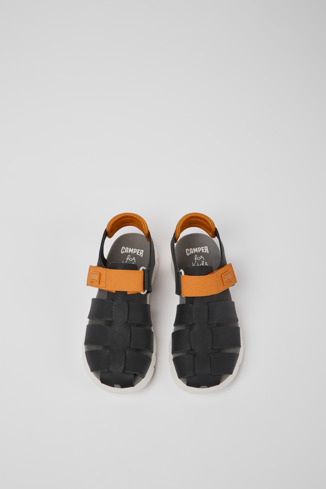 Overhead view of Oruga Black and orange leather sandals for kids