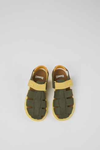 Overhead view of Oruga Green and yellow leather sandals for kids