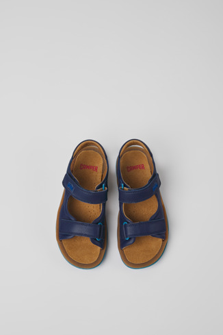 Overhead view of Bicho Blue leather sandals for kids