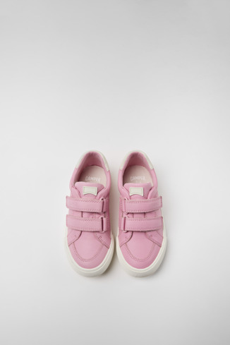Overhead view of Pursuit Pink and white sneakers for kids