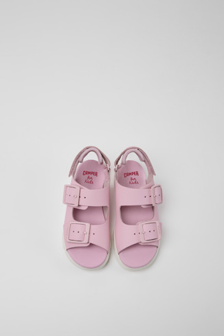 Overhead view of Oruga Pink leather sandals for kids