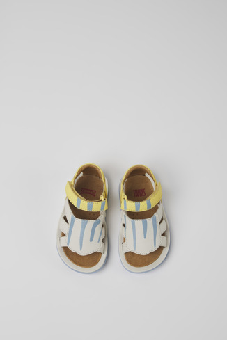 Overhead view of Twins Yellow and white leather sandals for kids