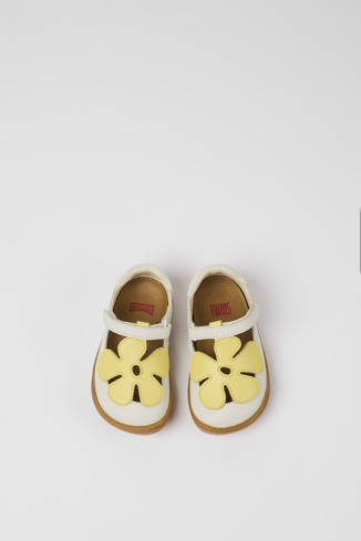 Overhead view of Twins White and yellow leather shoes for kids