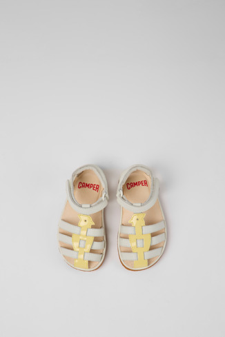 Overhead view of Miko White and yellow leather sandals for kids
