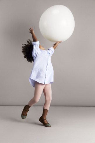 A model wearing Twins Brown and green leather ballerinas for kids