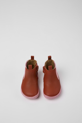 Overhead view of Peu Red and pink leather boots for kids