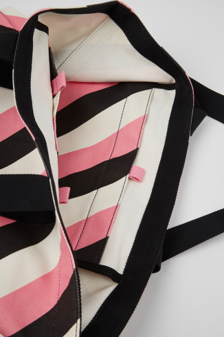 Close-up view of Ado Black, pink, and white recycled cotton tote bag