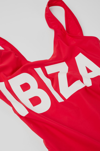 Close-up view of Vintage "IBIZA" swimsuit Red polyester swimsuit with white lettering